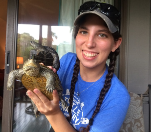 Image of woman holding two live turtles