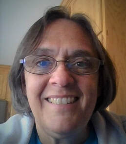 close-up selfie photo of Kathy Fell, smiling
