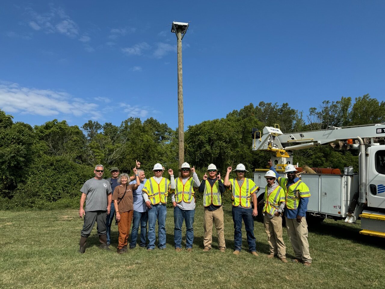 Susan Laume with osprey nesting platform team at Laurel Hill Park by Susan Laume