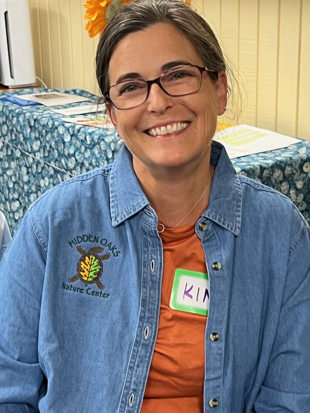 photo of volunteer wearing a Hidden Oaks Nature Center shirt