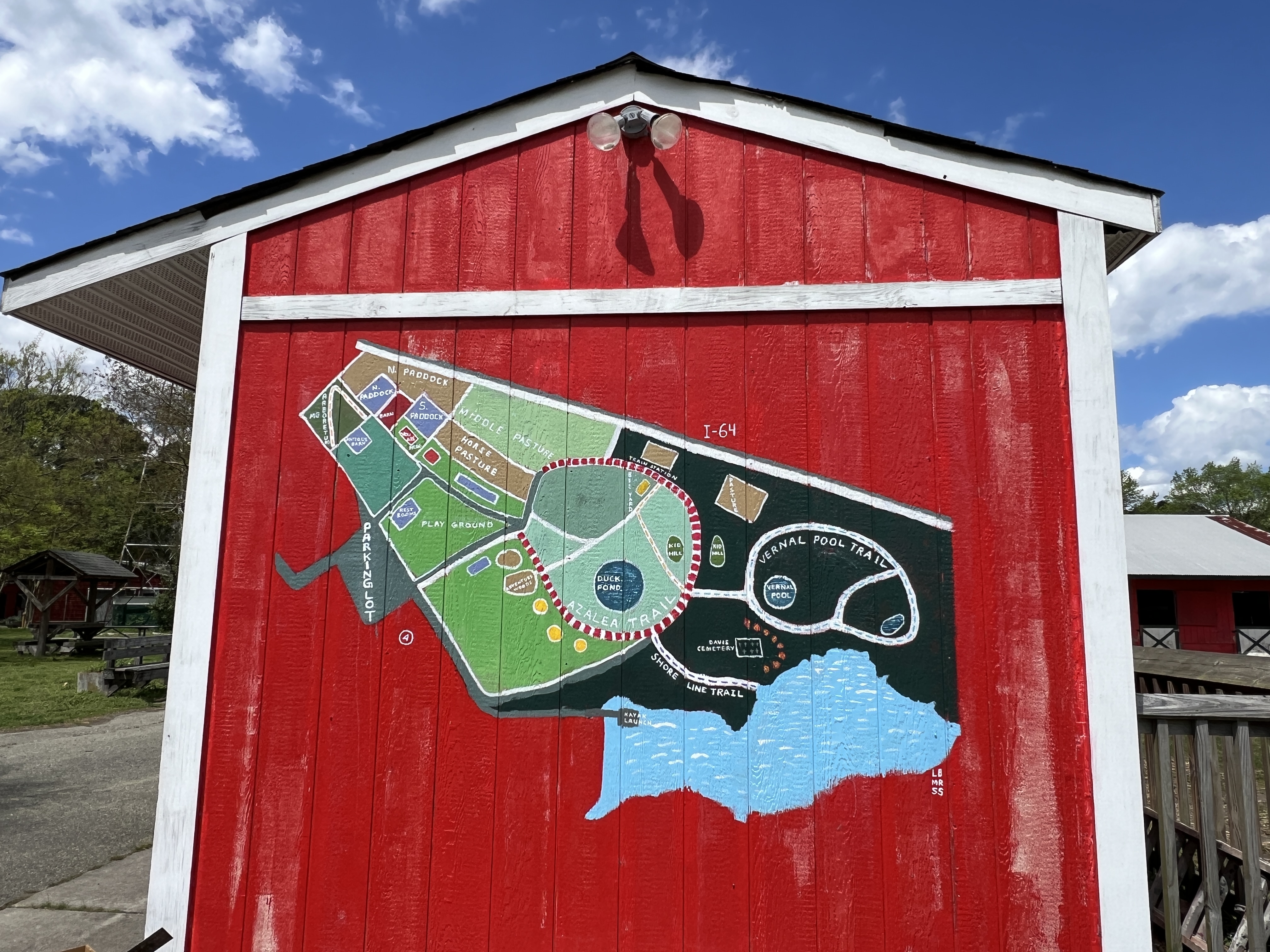 red building with a park map painted on the side