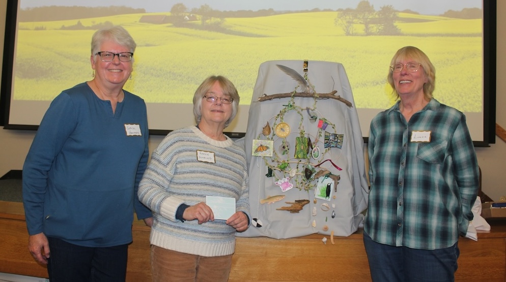 three people posed next to a collage of nature-related items