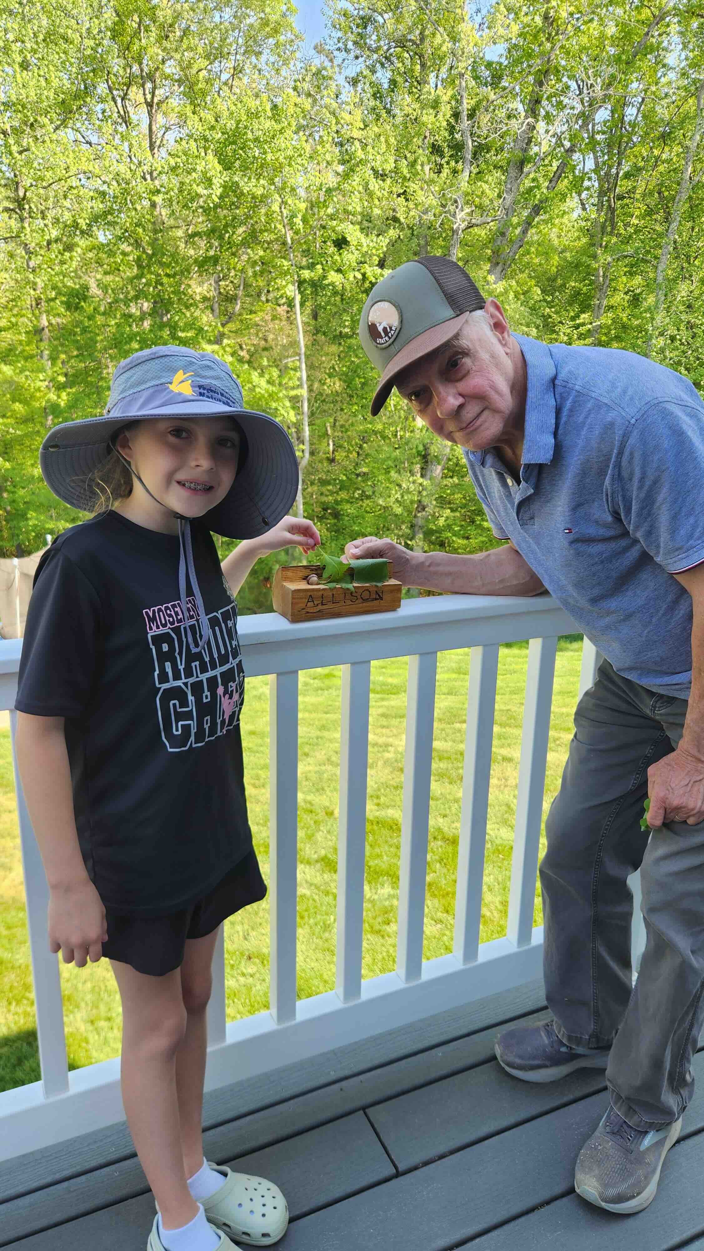 adult volunteer posing with young girl