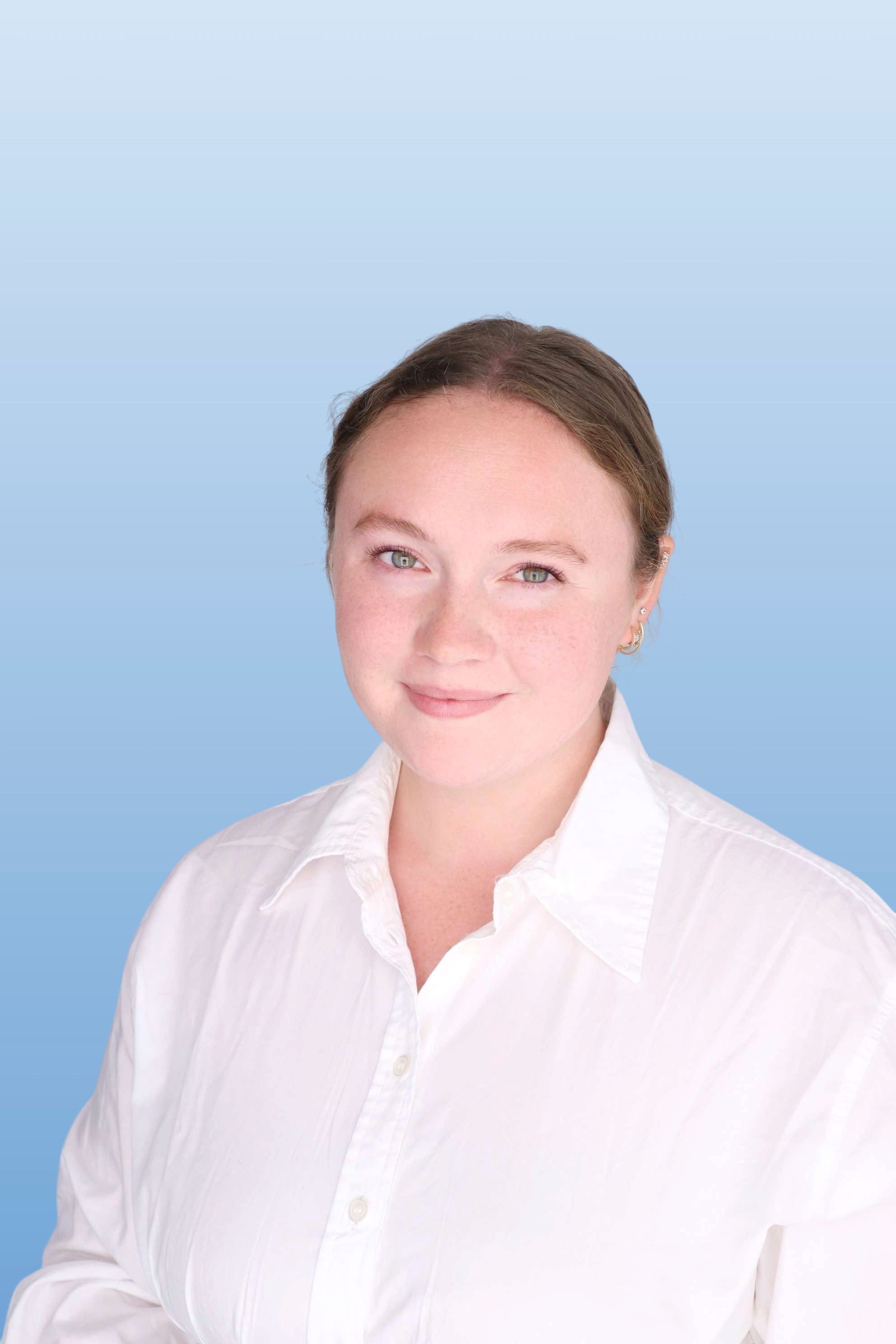 head shot of Kat Myer in white shirt